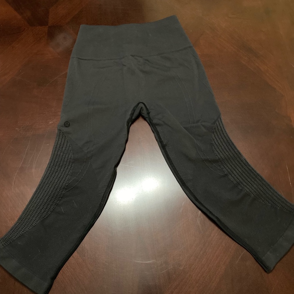 Lululemon Size 4 Crop. Very dark gray. Excellent used condition.
